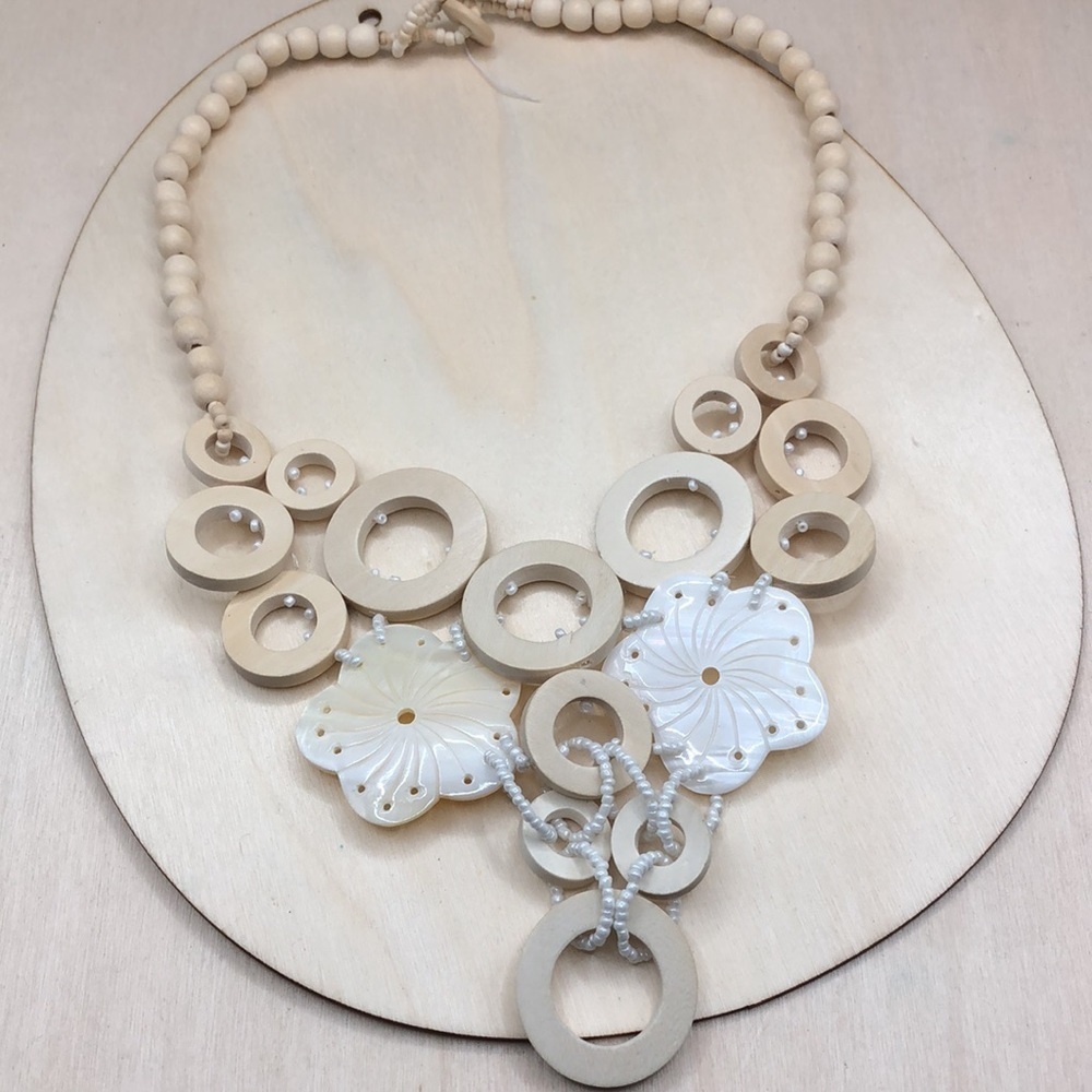 Artisan wooden and mother of pearl statement style boho necklace.
